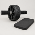 Ab roller wheel with steel axle and foam handles next to knee pad